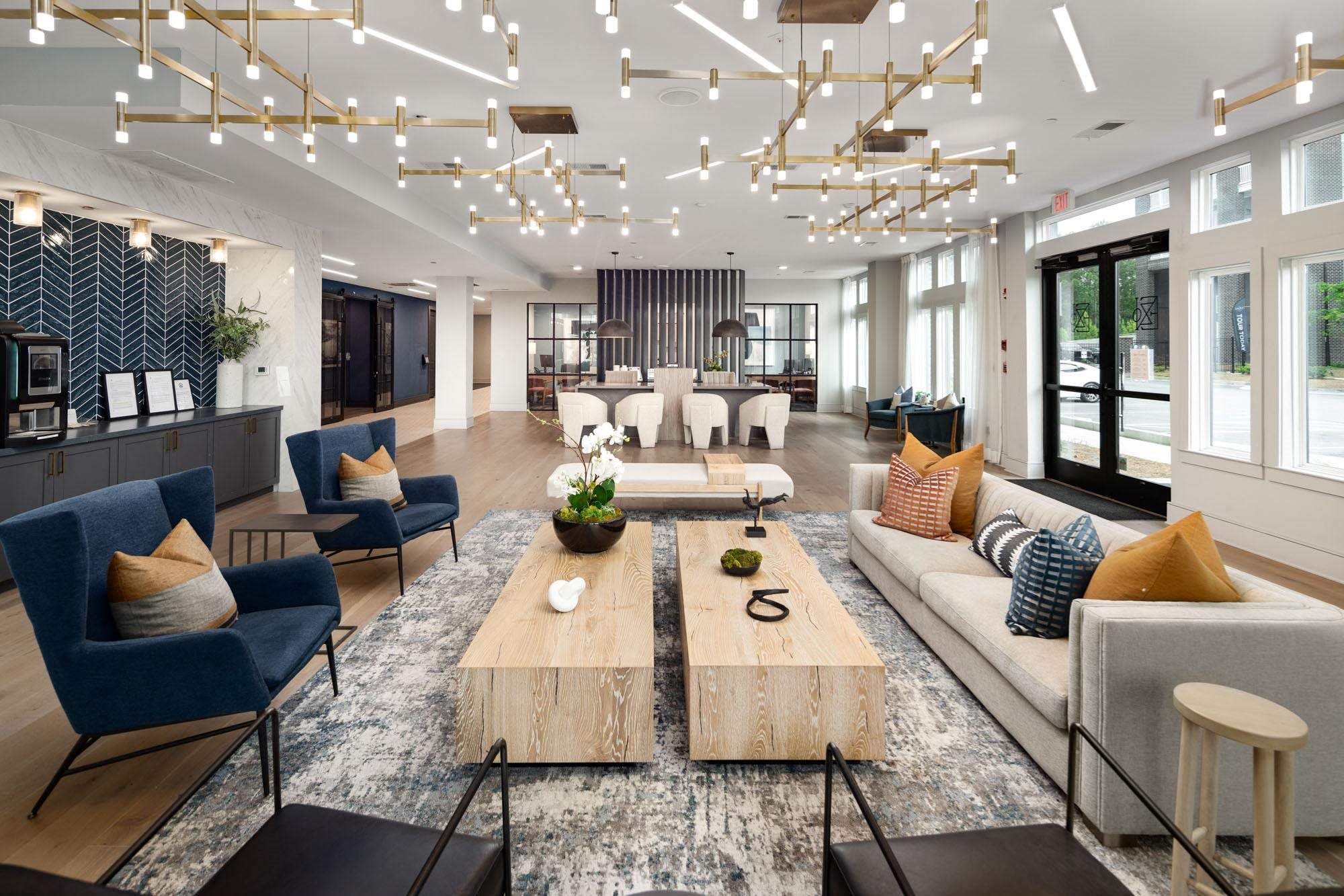 a living room with couches and chairs and a coffee table